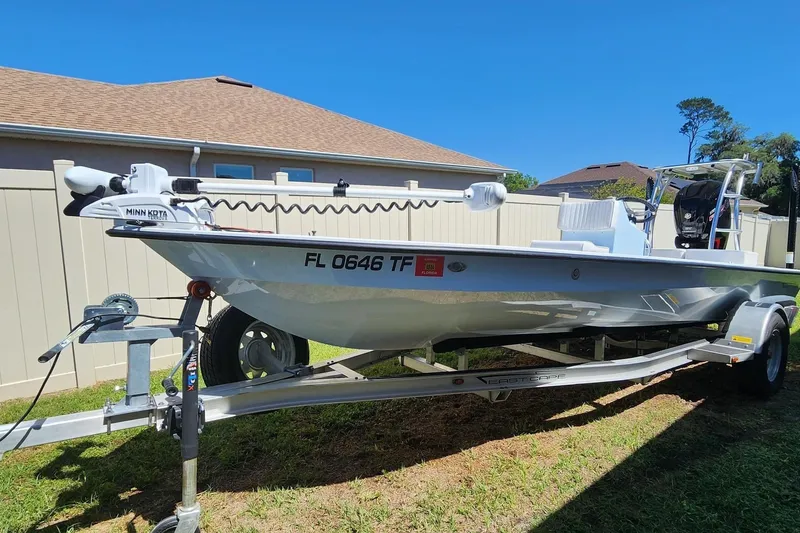 The Image of 2022 East Cape Vantage VHP boat on trailer, featuring Minn Kota trolling motor. - 0