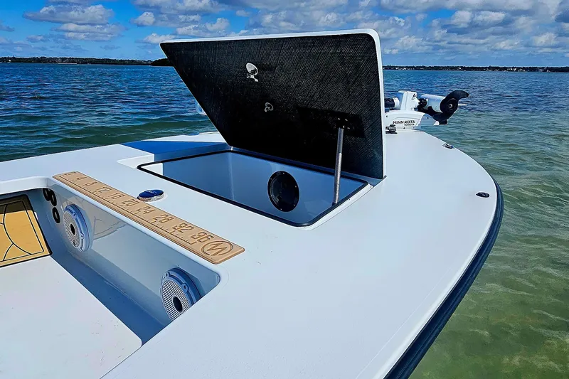 Slide: The Image of 2022 East Cape Vantage VHP boat on water, open hatch, clear sky. - 20