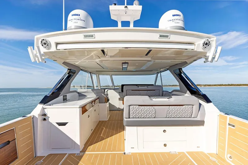 Slide: The Image of Manufacturer Provided Image: 2026 Regal LX43 luxury boat interior with modern seating and ocean view. - 14