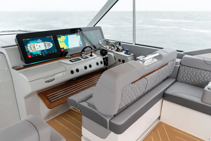 Slide: The Image of Manufacturer Provided Image: Luxurious 2026 Regal LX43 yacht interior with advanced navigation displays and plush seating. - 9