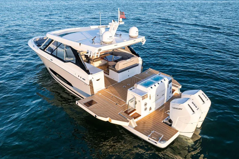Slide: The Image of Manufacturer Provided Image: 2026 Regal LX43 luxury boat cruising on open water, showcasing sleek design and powerful engines. - 3