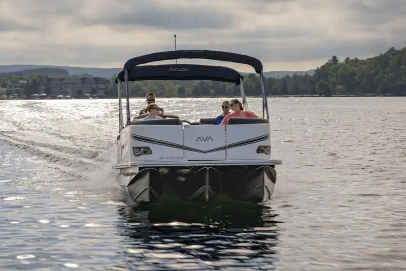 Slide: The Image of Manufacturer Provided Image: 2025 Avalon LSZ Quad Lounger Shift cruising on a serene lake. - 4
