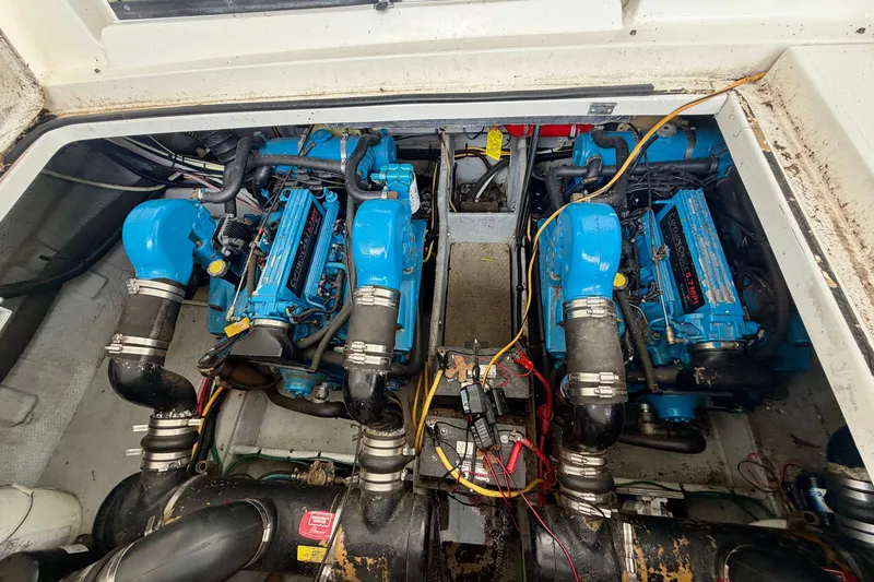 Slide: The Image of Engine compartment of a 2002 Silverton 330 Sport Bridge with twin blue marine engines. - 41