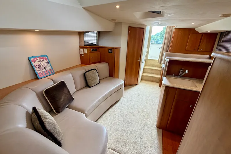 Slide: The Image of Interior of 2002 Silverton 330 Sport Bridge yacht with cozy seating and kitchenette. - 30