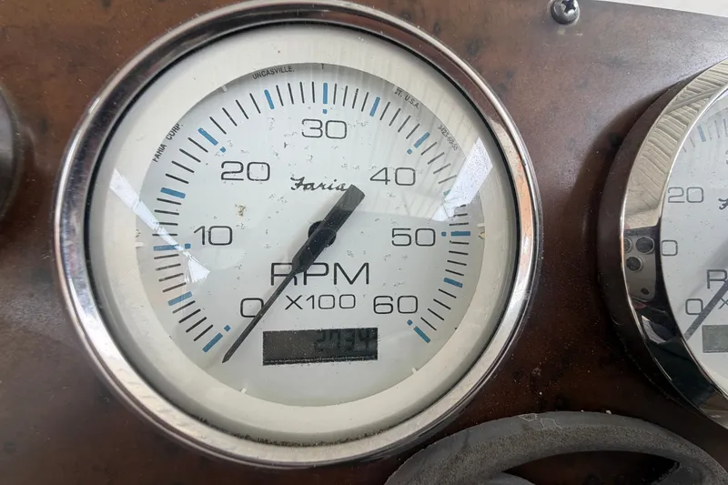 Slide: The Image of Close-up of a Faria RPM gauge on a 2002 Silverton 330 Sport Bridge. - 17