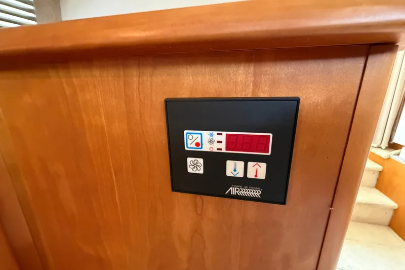 Slide: The Image of Control panel on 2002 Silverton 330 Sport Bridge, featuring temperature and fan settings. - 26