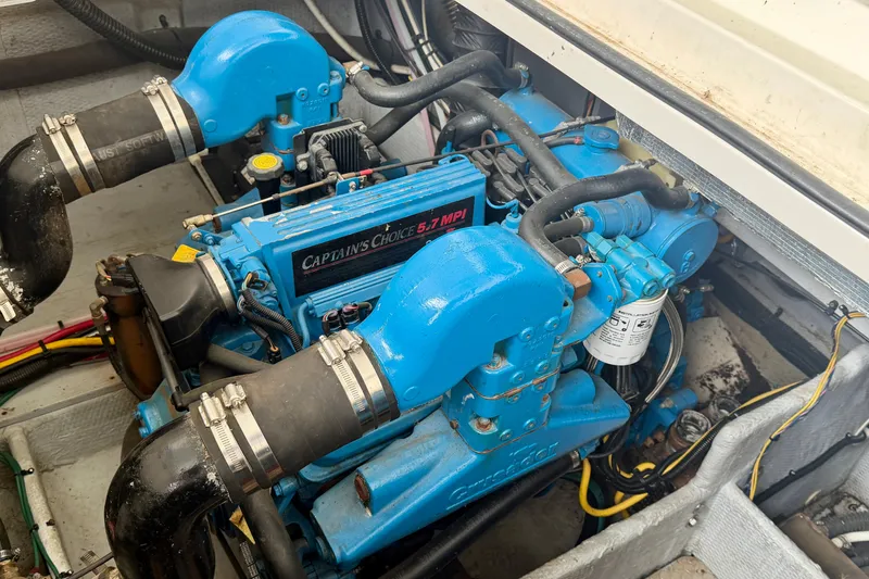 Slide: The Image of Engine compartment of a 2002 Silverton 330 Sport Bridge with Captain's Choice 5.7 MPI engine. - 42