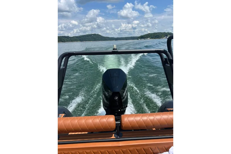 Slide: The Image of 2026 Patrol 760 RIB cruising on a scenic lake with clear skies. - 18
