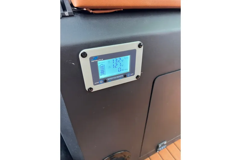 Slide: The Image of Digital display on 2026 Patrol 760 RIB showing battery voltage and power usage. - 26