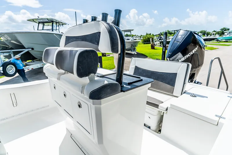 Slide: The Image of The image shows the cockpit of a 2019 Crevalle 24 Bay boat with a Mercury engine. - 15
