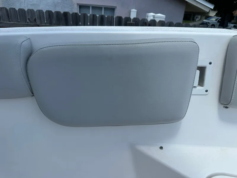 Slide: The Image of Gray padding on the interior wall of a boat, with a window in the background. - 26