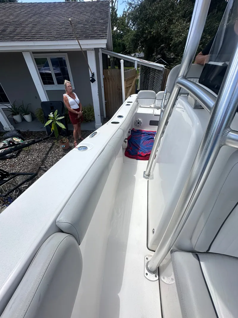 Slide: The Image of A 2020 Sea Fox 228 Commander is in a yard. A person stands nearby. - 31