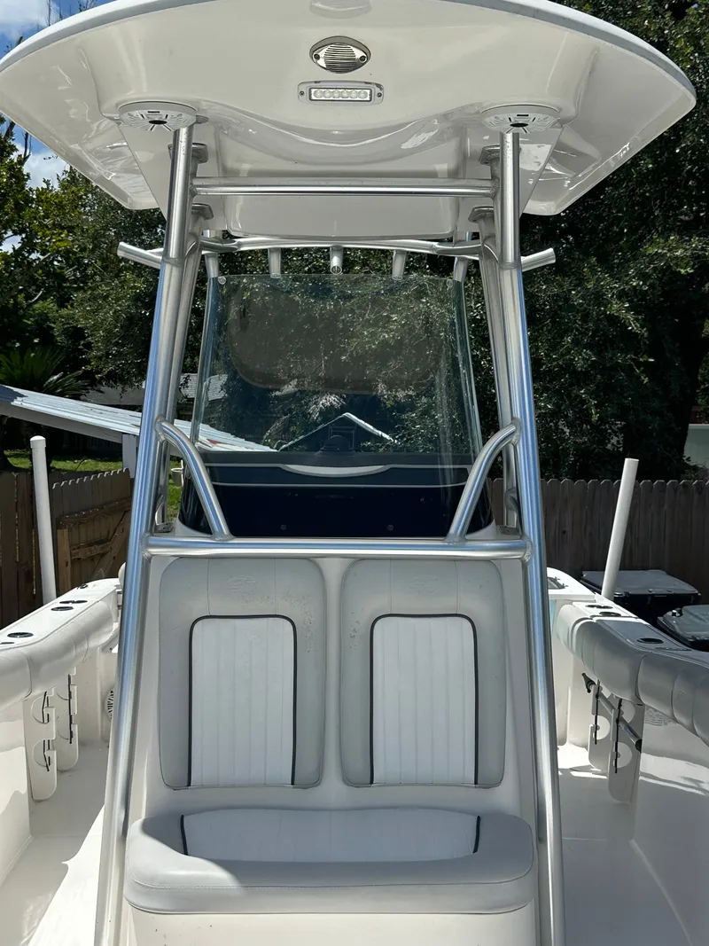 Slide: The Image of The image shows the cockpit of a 2020 Sea Fox 228 Commander with a T-top and seating. - 37