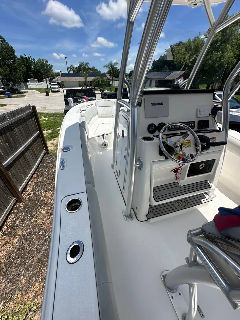 Slide: The Image of The image shows the cockpit of a 2020 Sea Fox 228 Commander with helm and seating. - 28