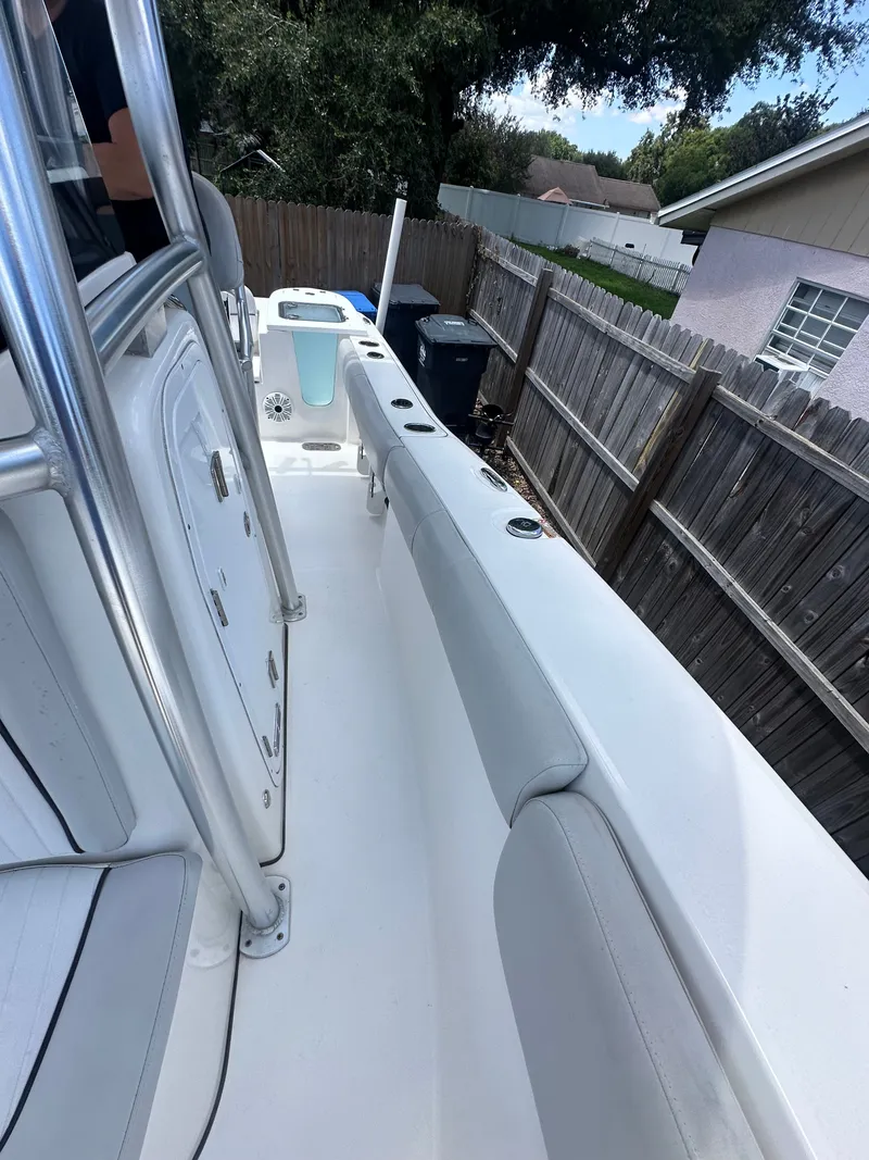Slide: The Image of The image shows the deck of a 2020 Sea Fox 228 Commander boat, parked in a yard. - 29