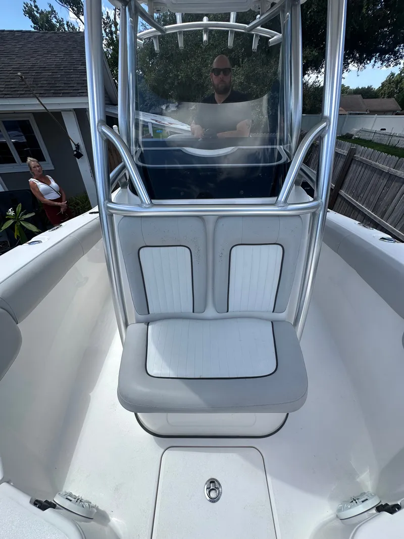Slide: The Image of A 2020 Sea Fox 228 Commander with a spacious, cushioned seating area and a T-top. - 47