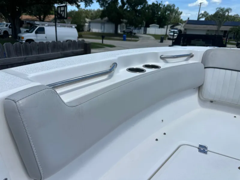 Slide: The Image of The image shows the seating area of a 2020 Sea Fox 228 Commander boat with cup holders. - 30