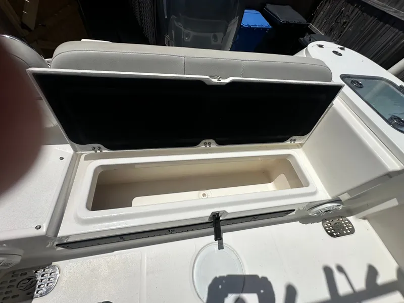 Slide: The Image of The 2020 Sea Fox 228 Commander features an open bench seat with storage underneath. - 43