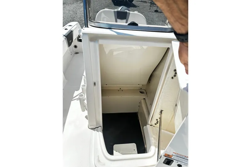 Slide: The Image of 2024 Robalo R180 Center Console storage compartment, open view, showcasing interior space. - 8