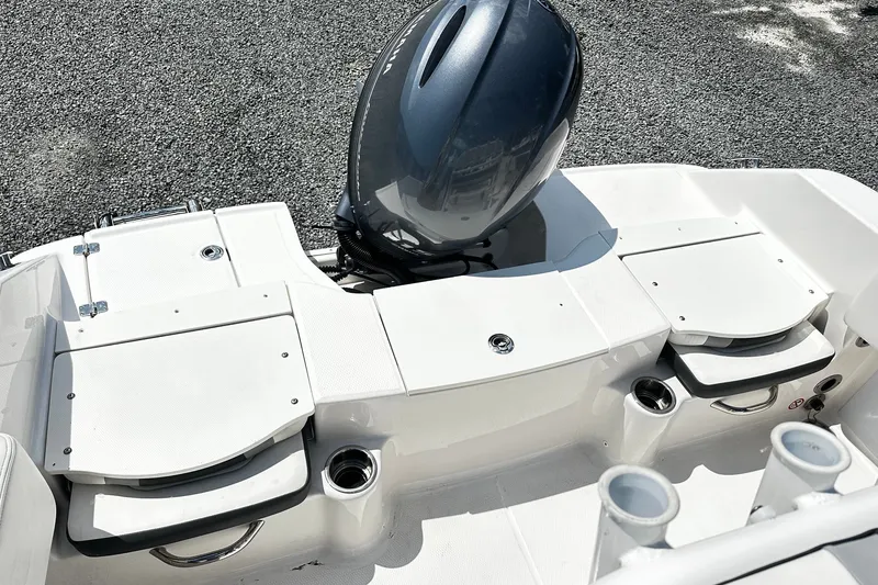 Slide: The Image of 2024 Robalo R180 Center Console boat with sleek engine and seating area. - 10