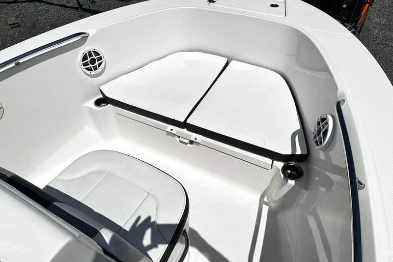 Slide: The Image of 2024 Robalo R180 Center Console boat interior with seating and cup holders. - 9
