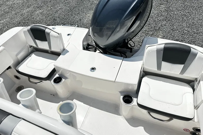 Slide: The Image of 2024 Robalo R180 Center Console boat interior with seating and motor. - 11