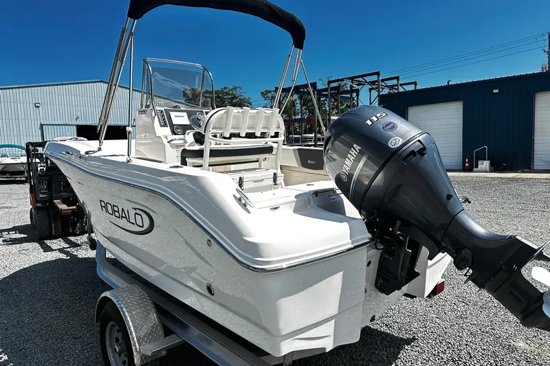 Slide: The Image of 2024 Robalo R180 Center Console boat with Yamaha engine on trailer. - 3