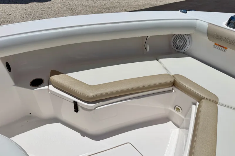 Slide: The Image of 2014 Everglades 255 Center Console boat interior with cushioned seating and speaker. - 9