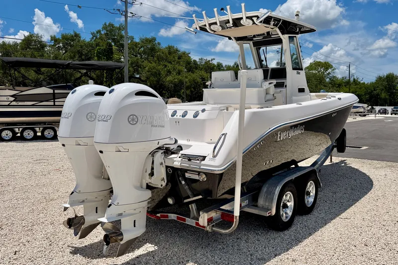 Slide: The Image of 2014 Everglades 255 Center Console boat with twin Yamaha engines on a trailer. - 7