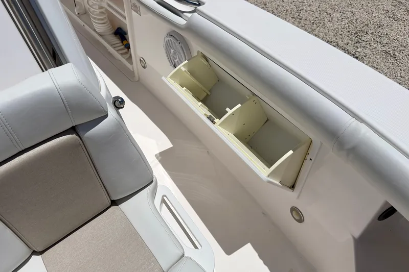 Slide: The Image of Interior view of a 2014 Everglades 255 Center Console boat with storage compartments. - 26