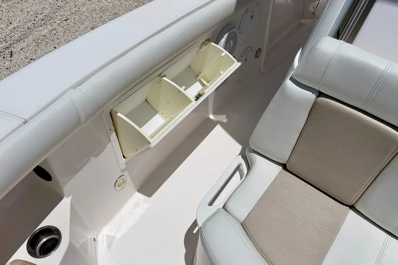 Slide: The Image of Interior view of a 2014 Everglades 255 Center Console boat with storage compartment. - 25