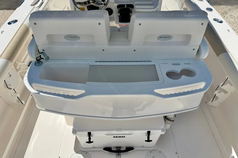 Slide: The Image of 2014 Everglades 255 Center Console boat interior with seating and storage compartments. - 24