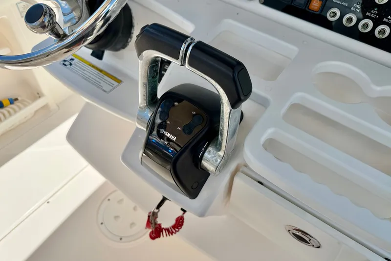 Slide: The Image of Throttle control on 2014 Everglades 255 Center Console boat dashboard with Yamaha branding. - 22