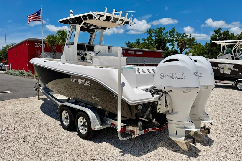 Slide: The Image of 2014 Everglades 255 Center Console boat with twin Yamaha engines on a trailer. - 5