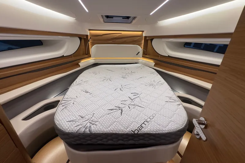 Slide: The Image of Luxurious cabin interior of 2027 Tiara Yachts 39 LE with a comfortable bed. - 30
