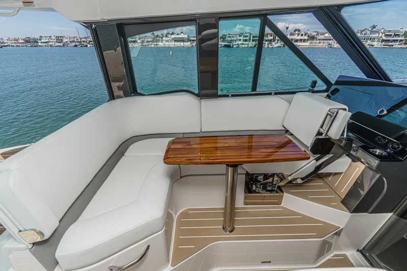Slide: The Image of Luxurious interior of 2027 Tiara Yachts 39 LE with elegant seating and wooden table. - 45