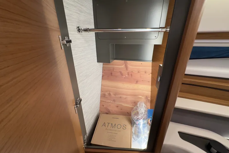 Slide: The Image of Interior storage space of 2027 Tiara Yachts 39 LE, featuring wooden finish and accessories. - 32