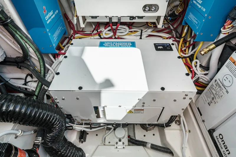 Slide: The Image of Engine room of 2027 Tiara Yachts 39 LE with electrical components and wiring. - 84