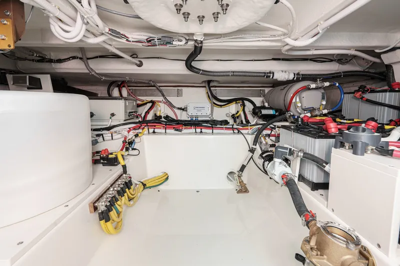 Slide: The Image of Engine room of 2027 Tiara Yachts 39 LE, showcasing wiring and mechanical components. - 86