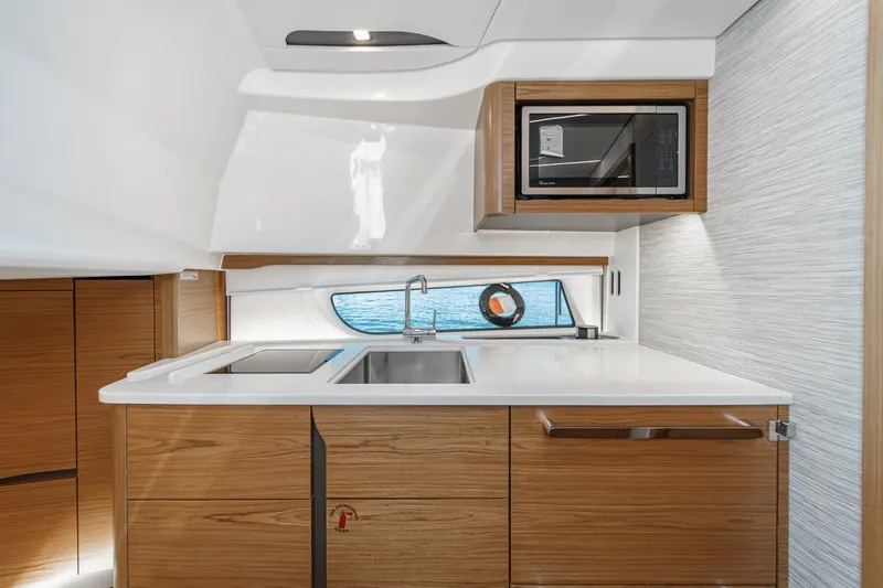 Slide: The Image of Modern kitchen interior of 2027 Tiara Yachts 39 LE, featuring sleek cabinetry and appliances. - 61