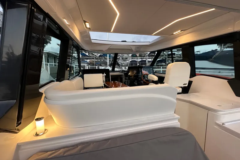 Slide: The Image of Luxurious interior of 2027 Tiara Yachts 39 LE with modern seating and ambient lighting. - 23