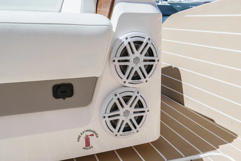 Slide: The Image of Speakers on 2027 Tiara Yachts 39 LE deck, featuring JL Audio and fire extinguisher sign. - 36