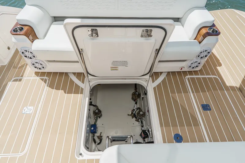Slide: The Image of Open hatch on 2027 Tiara Yachts 39 LE, revealing mechanical components on deck. - 82