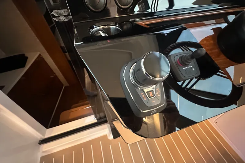 Slide: The Image of Control panel of 2027 Tiara Yachts 39 LE, featuring joystick and throttle controls. - 25