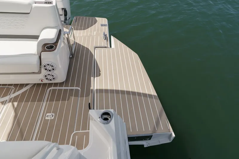 Slide: The Image of 2027 Tiara Yachts 39 LE swim platform with seating and cup holders. - 25