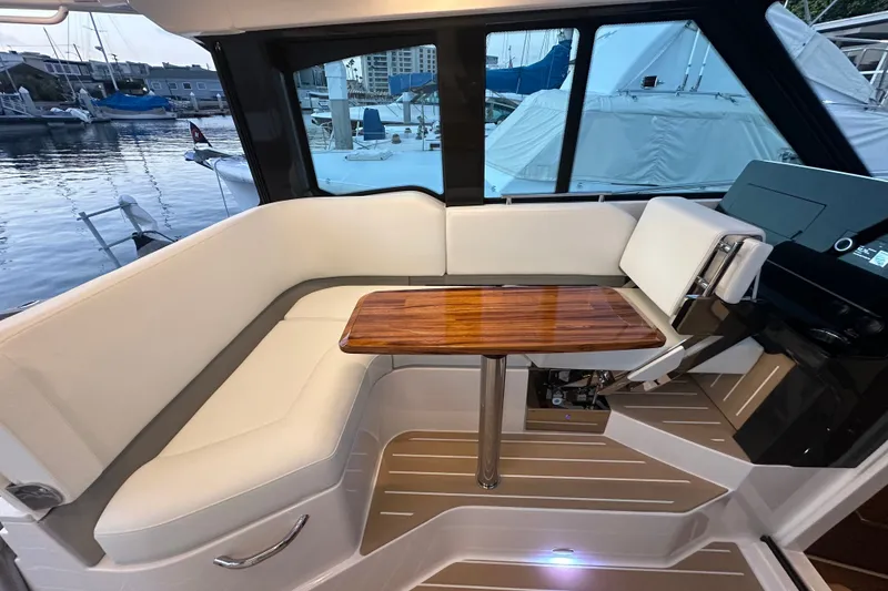 Slide: The Image of Luxurious interior of 2027 Tiara Yachts 39 LE with elegant seating and wooden table. - 28