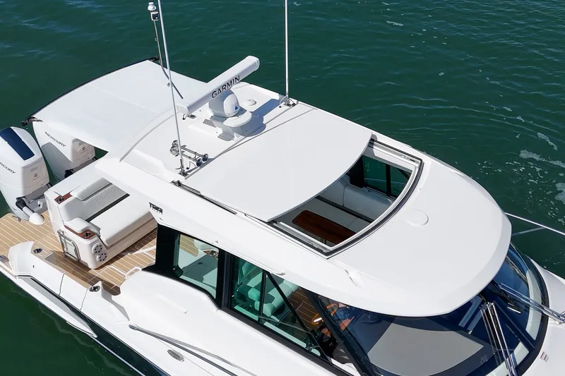 Slide: The Image of 2027 Tiara Yachts 39 LE luxury boat with sleek design on water. - 14