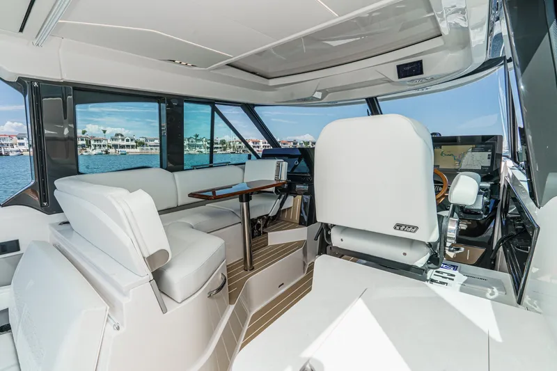 Slide: The Image of Interior of 2027 Tiara Yachts 39 LE, featuring luxurious seating and modern navigation equipment. - 44