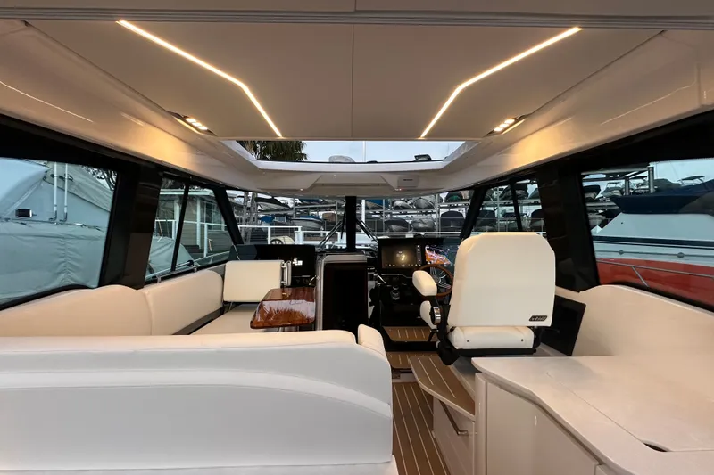 Slide: The Image of Interior of 2027 Tiara Yachts 39 LE, featuring modern seating and sleek design. - 22