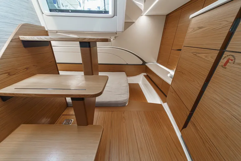 Slide: The Image of Interior of 2027 Tiara Yachts 39 LE, featuring sleek wooden cabinetry and modern design. - 72
